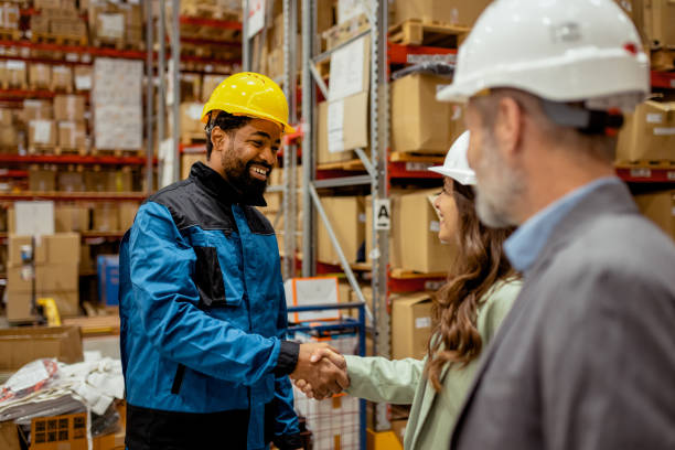 istock Mutual Respect: Female Warehouse Owner and Black Worker Shake Hands in Warehouse 2185268952
