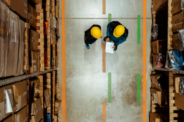 istock An aerial drone shot captures two warehouse workers are engaged in a discussion 2185269239