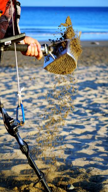 istock Coins on the beach revealed by metal detectors 2185270808