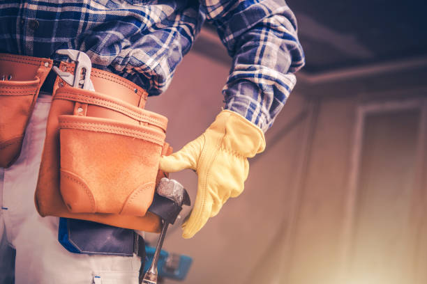 istock Craftsman Wearing Leather Tool Belt Preparing to Work on a Construction Project Indoors 2185273511