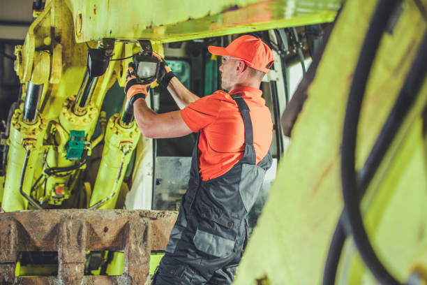 istock Worker Conducting Maintenance on Heavy Machinery in an Industrial Setting During Daylight Hours 2185273750