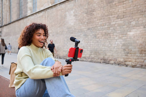 istock Influencer creating content for social media vlog in urban setting 2185274143