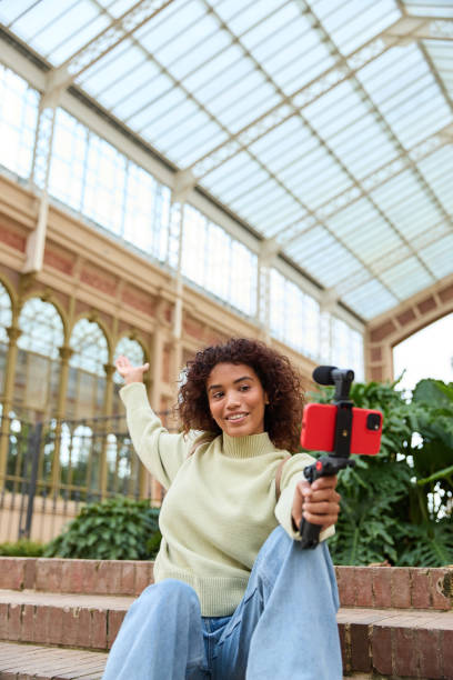istock Influencer creating content for social media in a greenhouse 2185274346