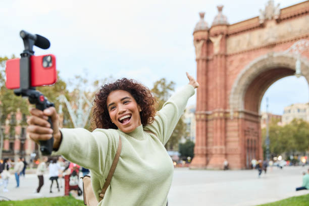 istock Young influencer filming vlog in front of arc de triomf in barcelona 2185274607