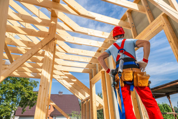 istock Construction Worker Observes Framing Progress of a New Residential Building on a Sunny Day 2185275478