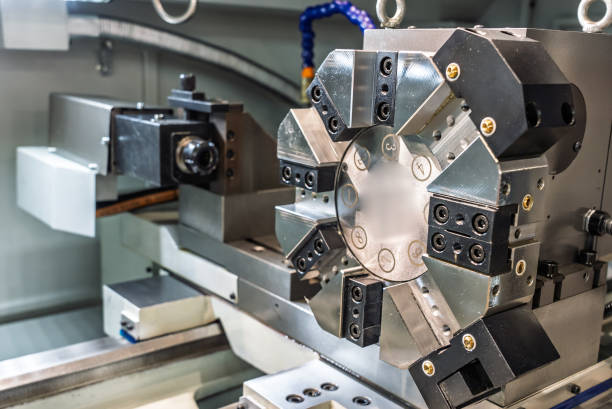 istock Inside view of a cnc machine. CNC lathe interior.Cnc machine. The CNC lathe machine or Turning machine. Turning numerical control machine with tools and chuck. 2185278667