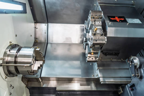 istock Inside view of a cnc machine. CNC lathe interior.Cnc machine. The CNC lathe machine or Turning machine. Turning numerical control machine with tools and chuck. 2185278865