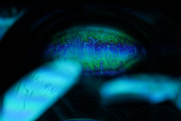 istock Bright rainbow reflection of liquid in macro, dispersion, surrealistic background, fantastic smooth movement 2185282200