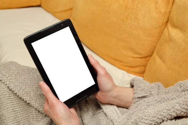 woman in bathrobe holding a tablet closeup