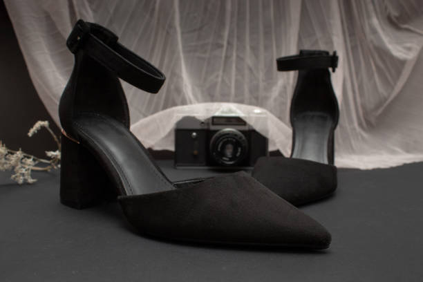 Female red shoe in dark room