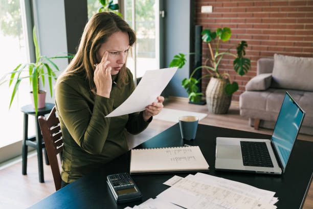 istock Tired Businesswoman In The Office Has Difficulty To See Texts On The Document 2185286935