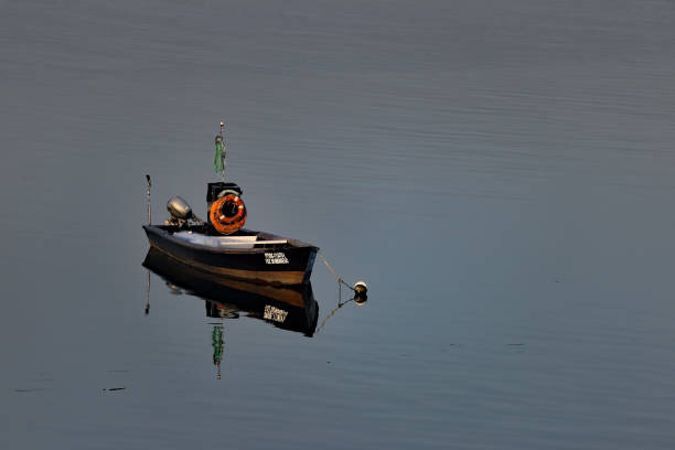 Fishing boat in absolute stillness.