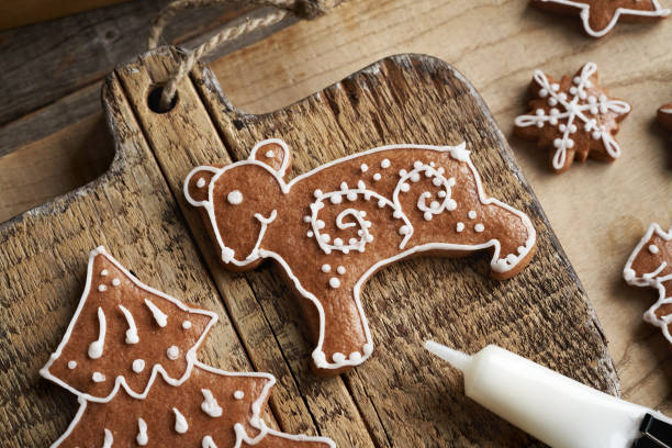 Bear shaped homemade gingerbread Christmas cookie decorated with white icing