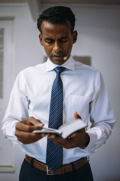 istock Christian pastor preparing for sermon in office before church service 2185288419