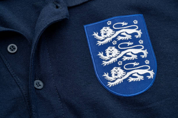LONDON, UK - October 23rd, 2024 : Blue replica England national football polo shirt with the three lions emblem.