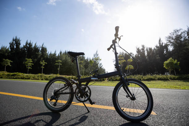istock Folding bike on sunny seaside road 2185289156