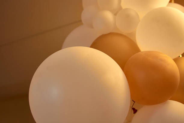 istock Large white and yellow balloons decorating an elegant event hall 2185289357