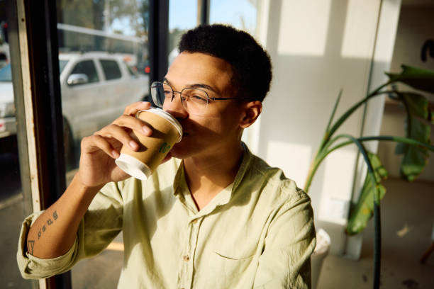 istock A mixed race man drinking coffee in the afternoon 2185290245