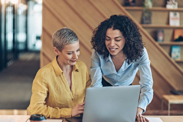 istock Two businesswomen working in office 2185290924