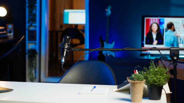 istock Laptop on desk in empty home production studio 2185294390