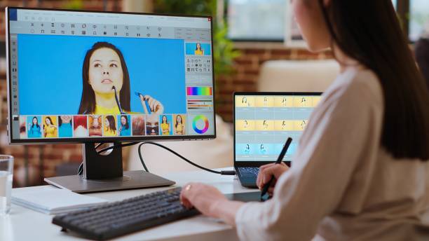 istock Expert artist woman edits digital photos on her computer in a creative office 2185295167