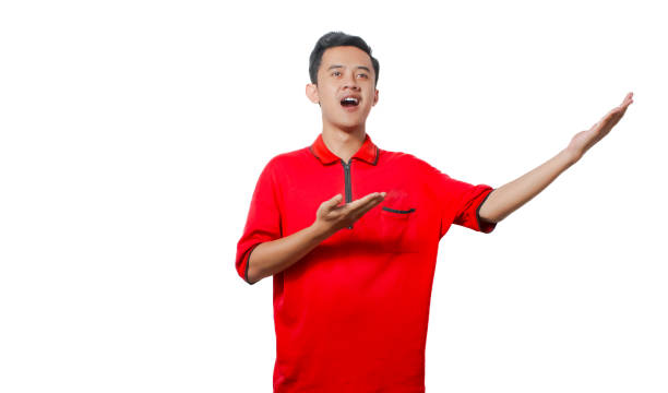 istock A man wearing red gestures excitedly against a white background. 2185295947