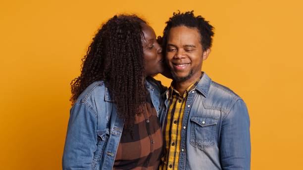 istock Affectionate romantic wife whispering intimate things to her husband 2185296400