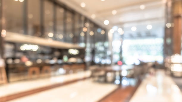 istock Blurred hotel or office building lobby blur background interior view with reception hall lounge, modern luxury white room space with blurry corridor and building glass wall window 2185300062