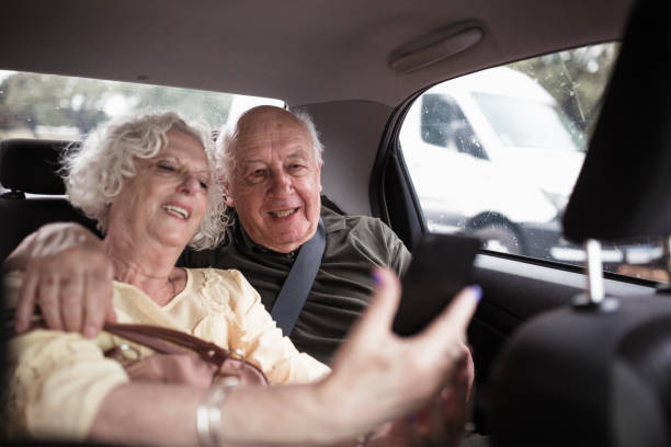 istock Title: Elderly Couple Taking Selfie in Car 2185302897