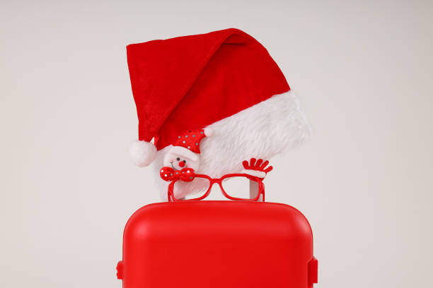 istock A red suitcase with a New Year's hat 2185305169