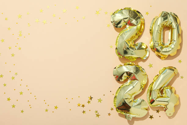 istock New Year 2024 with golden balloons on a light background 2185305321