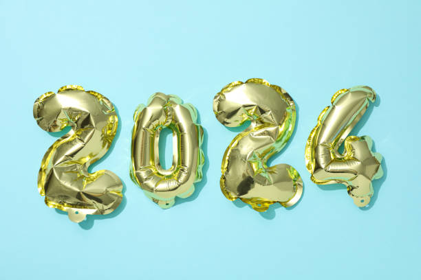 istock New Year 2024 with golden balloons on a light background 2185307245