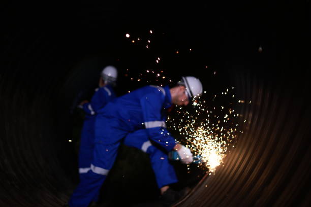 Blurly scene Senior engineer and site engineer work grinding in construction tunnel