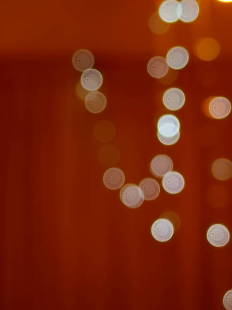 istock Bokeh lights garland on red background. 2185310209