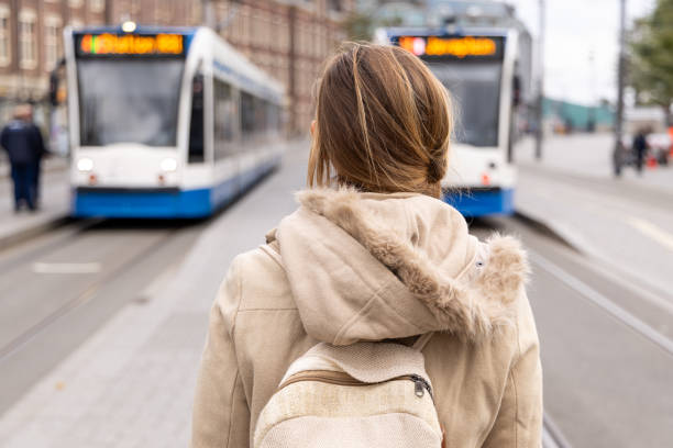 istock Woman with Backpack Waiting for Trams in the City 2185313671