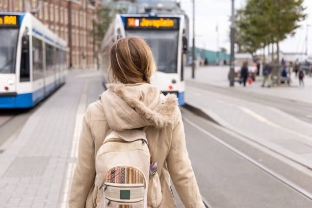 istock Woman with Backpack Waiting for Trams in the City 2185313682