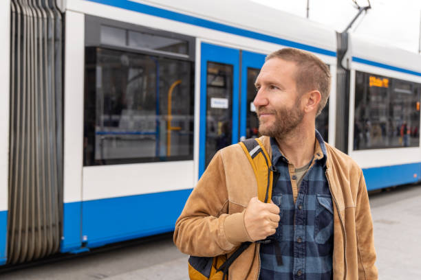 istock Smiling Man Near a Tram in a Modern City 2185313774