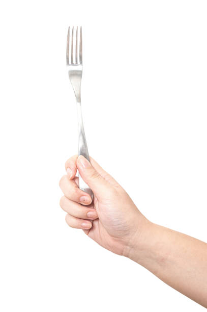 istock Female hand holding a silver steel fork isolated on white background. 2185315324