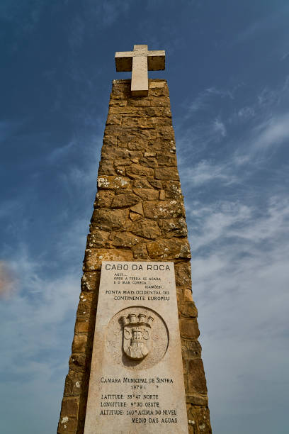 istock stone cross at the rugged rocky coastline at cabo da roca. 2185318574