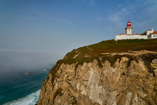 istock light house at the rugged rocky coastline at cabo da roca. 2185318580