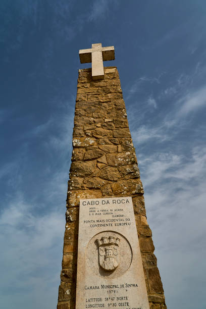 istock stone cross at the rugged rocky coastline at cabo da roca. 2185318584