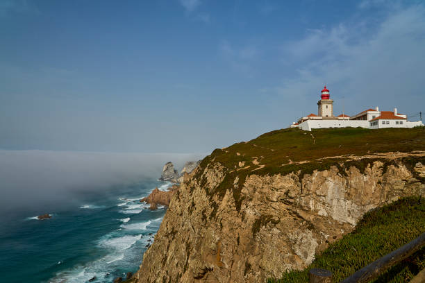 istock light house at the rugged rocky coastline at cabo da roca. 2185318627