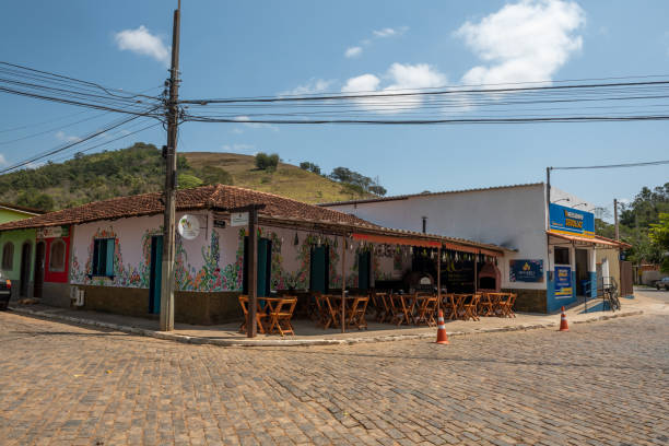 Paraiba do Sul, Brazil. Street corner in Sebollas, featuring a restaurant and bar, with chairs outside