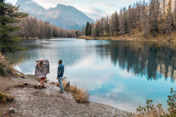 istock Couple Strolling by Scenic Mountain Lake 2185323523