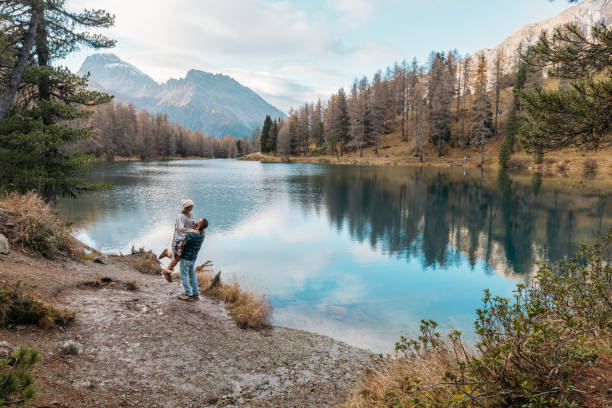 Couple Embracing by a Scenic Mountain Lake