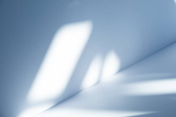 istock Studio style background wall decoration presentation uses white and blue tones. with shadows cast from a nearby window, concept creating a decorative 2185329174
