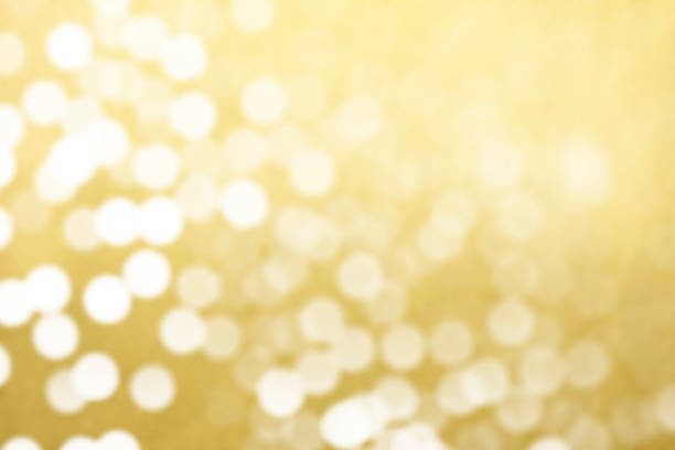 Defocused abstract glitter light sparkle golden background