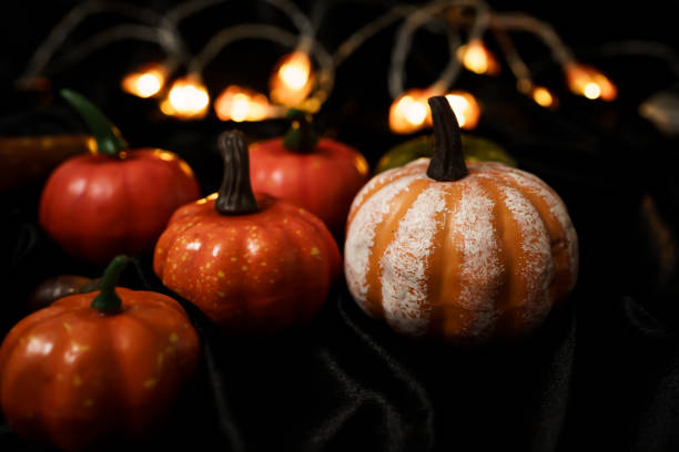 istock Halloween decorations background. Halloween Scary pumpkin head on wooden table Halloween holiday concept 2185331235