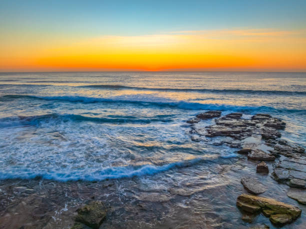 istock Sunrise at the Seaside with an Orange Horizon 2185331771