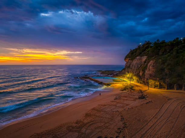 istock Pretty Sunrise at the seaside with rain clouds 2185331834